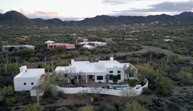 Desert oasis in the heart of the Tucson Mountains nestled by iconic Saguaros.
