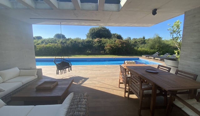 Design house with pool near the beach.