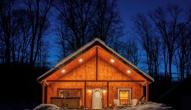 Designed for slow mornings and star-filled nights, this secluded Northeast Kingdom escape features a year-round heated hot tub and private pond.