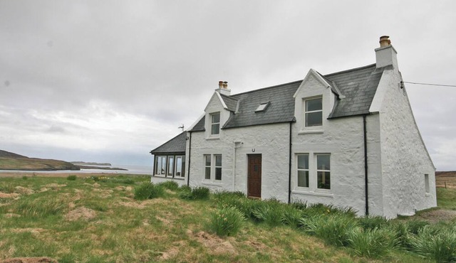 Detached croft cottage in an elevated position above Aird Bay in the spectacular north of Skye.