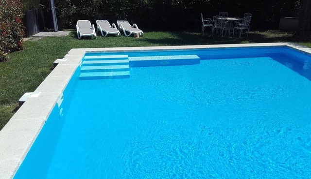 Detached house with a large garden and a huge pool