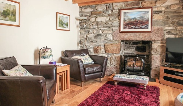Detached former croft cottage set in 8 acres of unspoilt hillside amidst stunning scenery.