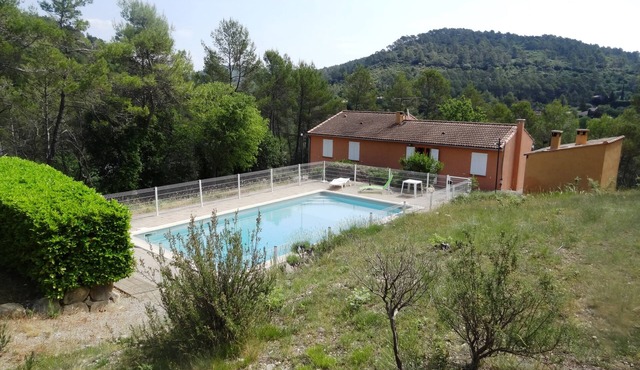 Detached villa with shared pool and summer kitchen.