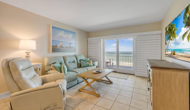 Direct oceanfront 2/2 with private balcony, heated beachfront pool, and beach access