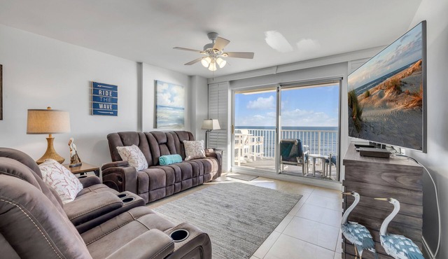 Direct oceanfront 2/2 condo with large private balcony, heated pool, and garage parking