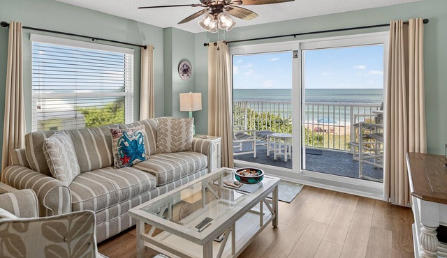 Direct oceanfront 2/2 corner condo with large balcony, heated pool, and garage parking