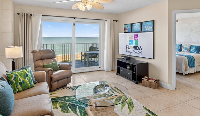 Direct oceanfront 2/2 condo with a private balcony, heated beachfront pool, and garage