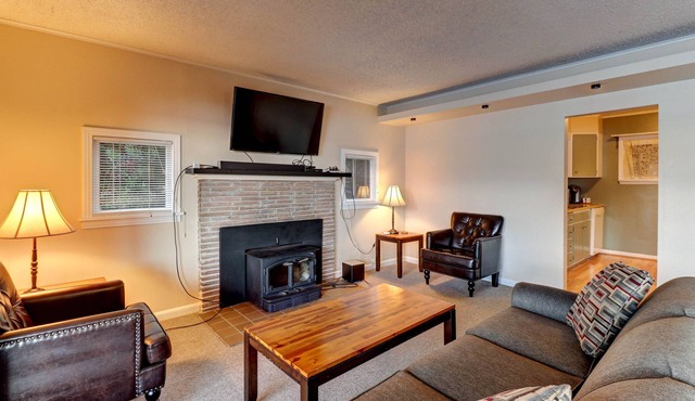 Direct waterfront - welcoming home with fireplace, full kitchen & furnished deck