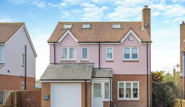 Discover coastal bliss at The Dunes, your perfect family haven by Beadnell Bay.