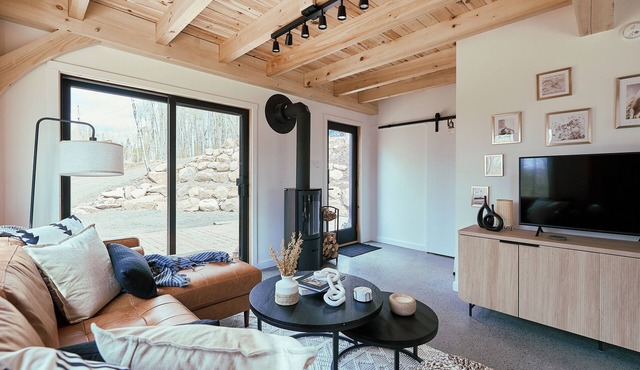 Discover Falcon Ridge's Charming Post and Beam Lake Retreat | Laurentians