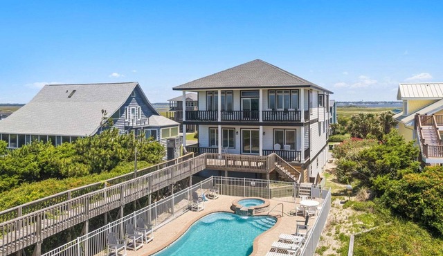 Discover Peace on the Beach, a stunning 6BR, 5BA oceanfront retreat in Oak Island.