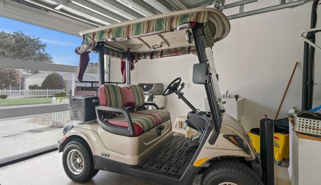Discover Relaxation and Fun in a Charming Patio Villa with a Golf Cart!