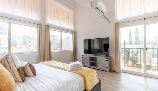 Discover spacious comfort in this 4BR, 3-bath retreat featuring a sun deck, dedicated workspace, and thrilling ping-pong entertainment.