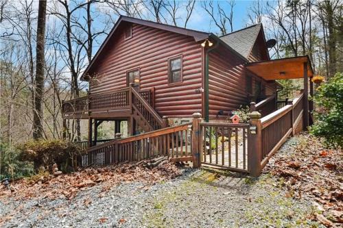 Discover tranquility at Hidden Oasis, a charming home nestled in serene Cherry Log Mountain