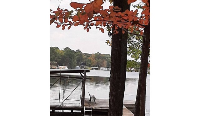 Dock Holiday is a lakefront home with hot tub. Bring your fishing pole.