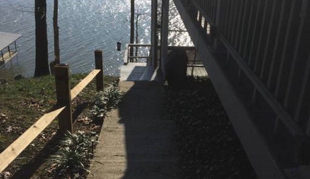 Dock on lake and our 750 sq ft cottage home at Kentucky Lake