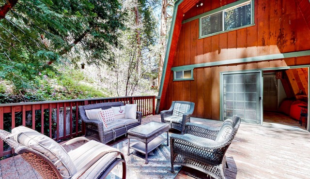 Dog-friendly 2-story home with large deck, tree views, fireplace, & W/D