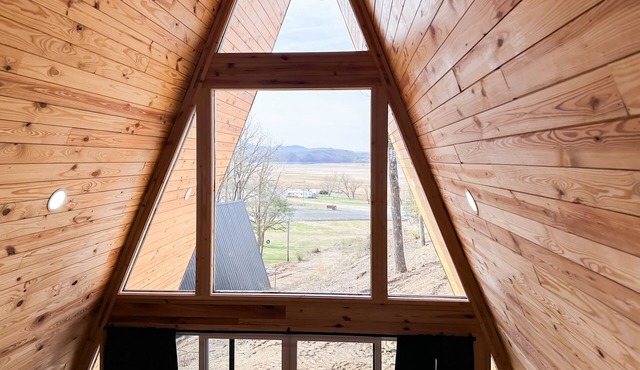 Dog-friendly A-frame cabin with loft, balcony, full kitchen, & washer/dryer