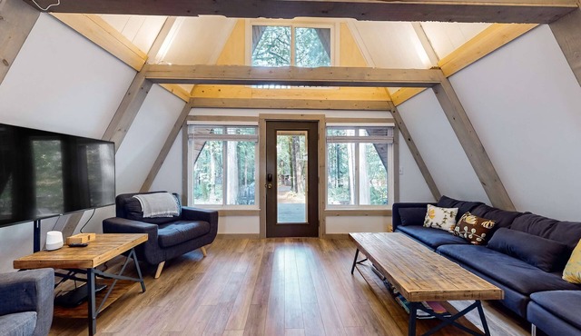 Dog-friendly A-frame near the river with game room, firepit, wood stove, & grill
