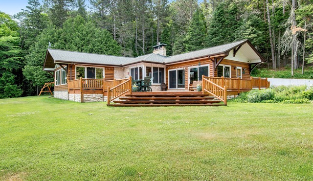 Dog-friendly and secluded lakefront gem with a full bar, private dock, and views