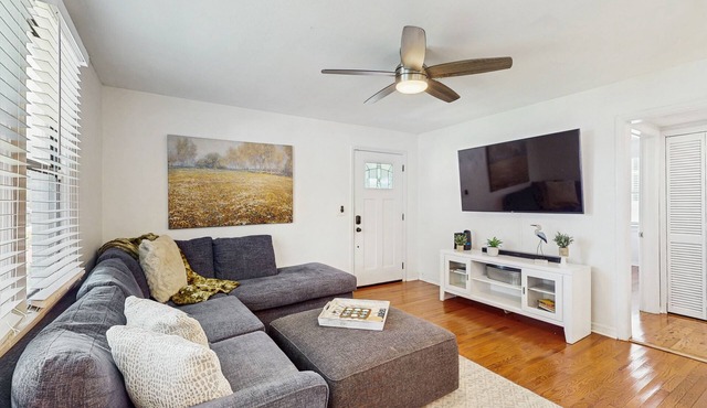 Dog-friendly bungalow with a fenced yard, deck, washer/dryer, & AC