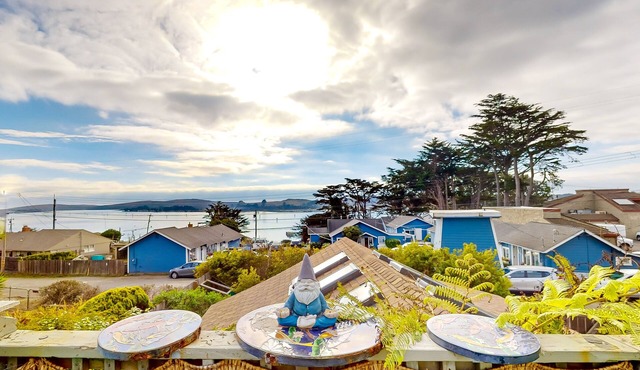 Dog-friendly coastal stay with large balcony, water views, & wood fireplace
