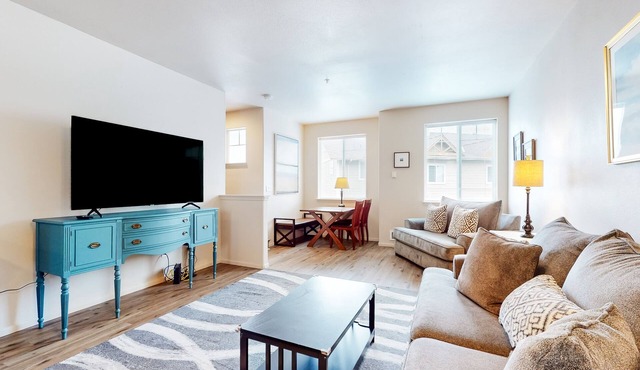 Dog-friendly condo with river views, private W/D, full kitchen, & great location