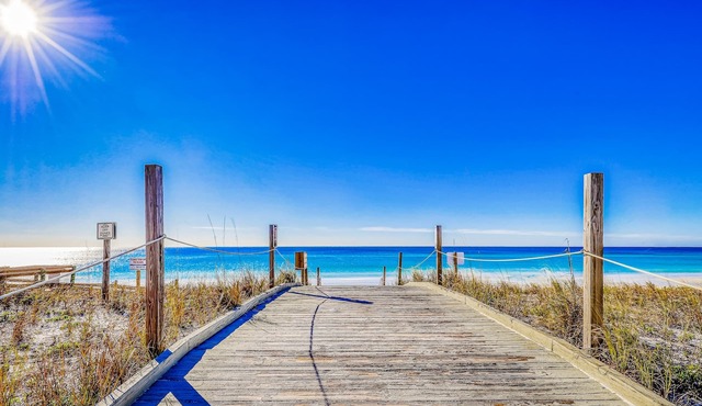 Dog-friendly condo with private beach access, pools, hot tubs, and central AC