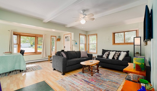 Dog-friendly cottage with fenced yard, firepit, W/D, & WiFi - walkable location
