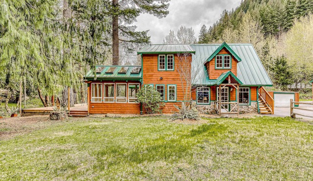 Dog-friendly creekside home with entertainment barn, private hot tub & firepit