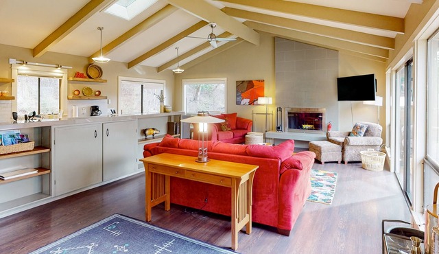 Dog-friendly forest cottage with a scenic deck, grill, fireplace, & central AC