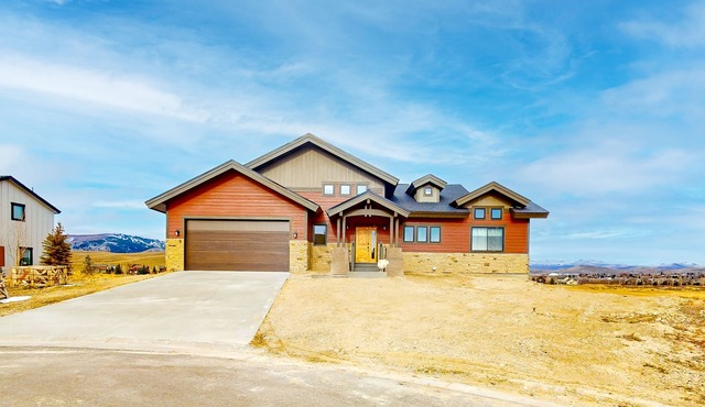 Dog-friendly golf course-front home with mtn & ski views, fireplace, & balconies