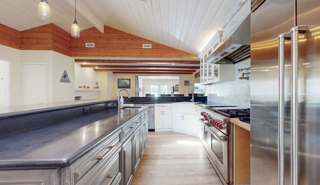 Dog-friendly home near downtown & beach with private heated pool, spa, & grill