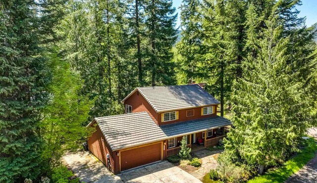Dog-friendly home with hot tub, shared pool, firepit, fireplace, & river access