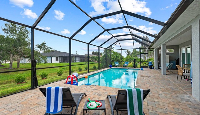 Dog friendly home with private pool, lanai, family games, and internet