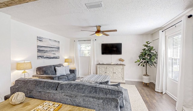 Dog-friendly home with fenced yard, patio, grill, & park across the street