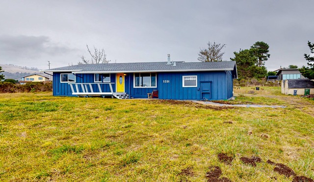 Dog-friendly home with ocean/sunset views, large yard, & firepit