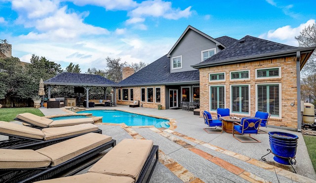Dog-friendly home with fenced yard, pool, office, piano, & W/D