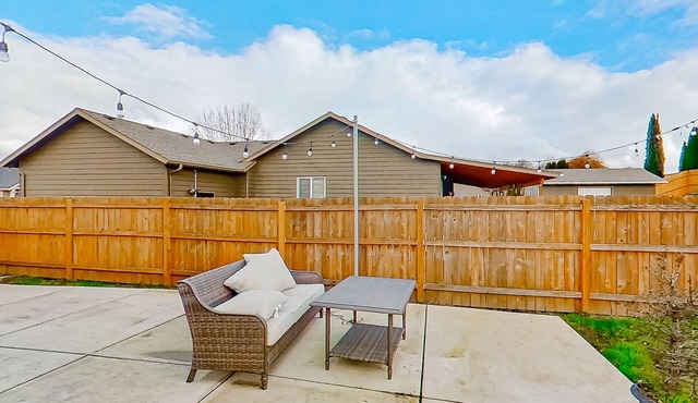 Dog-friendly home with large enclosed yard, patio, BBQ, office, & private W/D