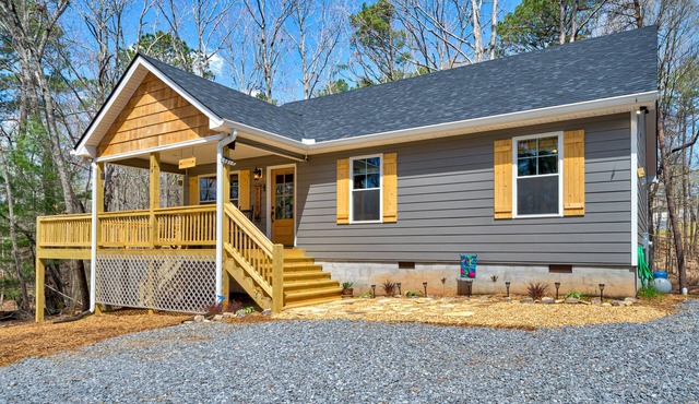 Dog-friendly home with wraparound deck, firepit, grill, WiFi, and pool