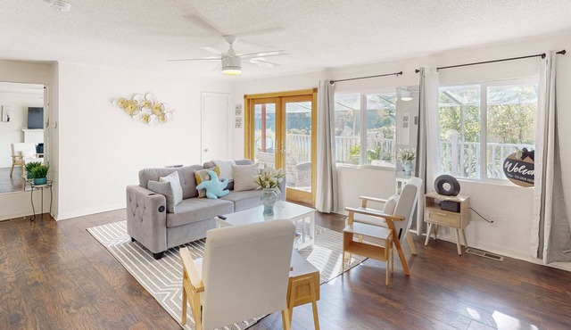 Dog-friendly lake view home with kitchen & kitchenette, patio, sunroom