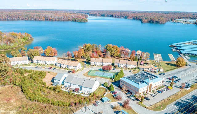 Dog-friendly lake-view townhome with firepit, grill, kayaks, tennis, AC, & W/D