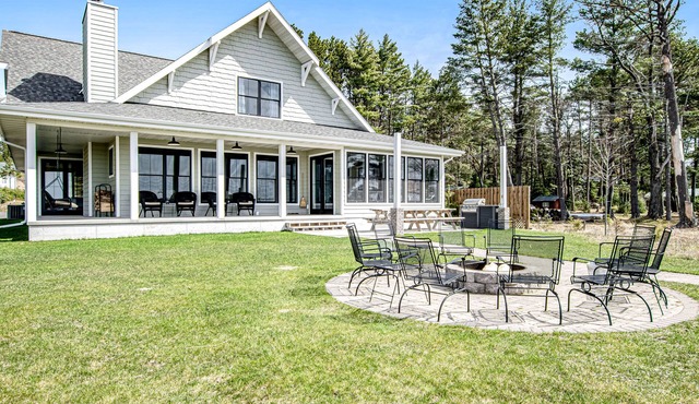 Dog-friendly, lakefront house with beach access, dock, AC, W/D, patio, & firepit