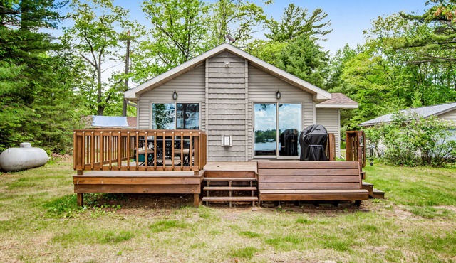 Dog-friendly lakefront home with high-speed WiFi, dock, private w/d, & firepit