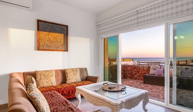 Dog-friendly ocean-view villa with patio, outdoor pool, streaming, partial AC