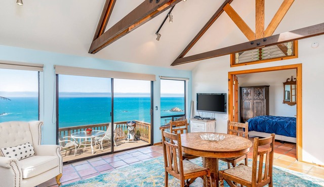 Dog-friendly, ocean-view cottage with private hot tub, deck, & free EV charger