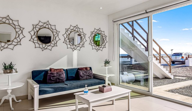 Dog-friendly oceanfront villa with rooftop patio, pool access, & kitchen