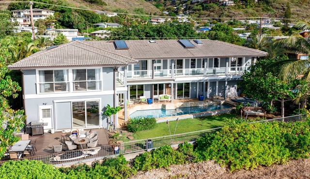 Dog-friendly oceanfront estate with a pool, hot tub, lanai, & private beach