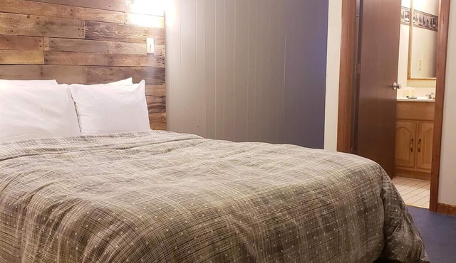 Dog Friendly, Private Guestroom with TWO QUEEN beds and two small bathrooms inside the Lodge at North Ironwood Acres resort.