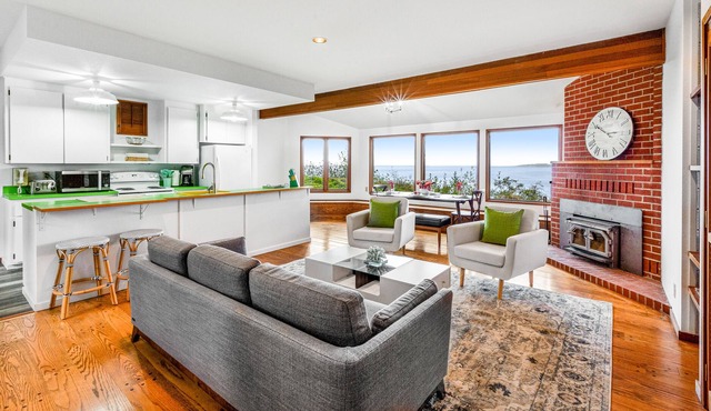 Dog-friendly Puget Sound cottage with private gym, sweeping views, fireplace